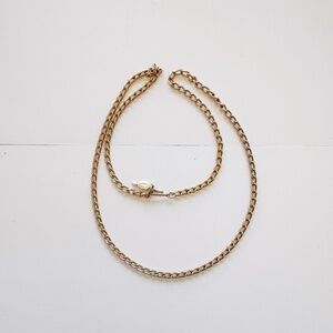 A Sarah Cov gold-tone necklace, 24 inches.
